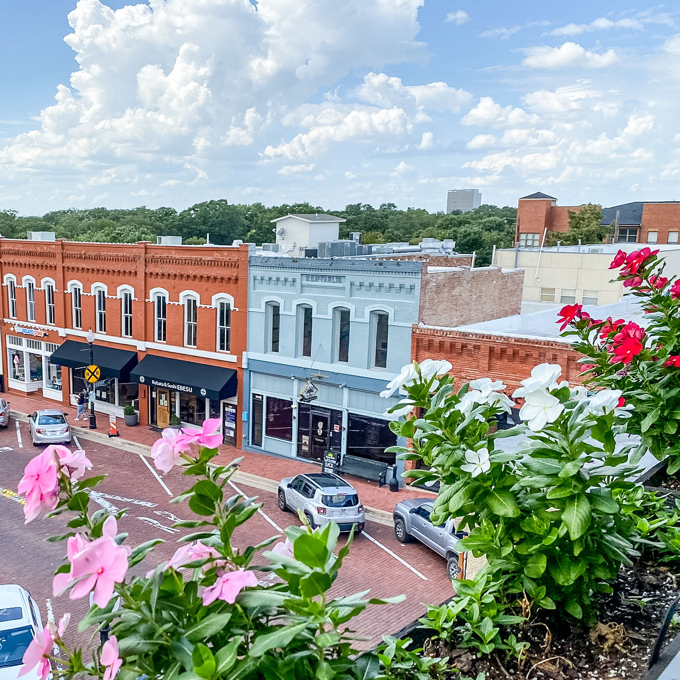 Colorful historic buildings and brick streets in the Downtown Plano Arts District, Texas.